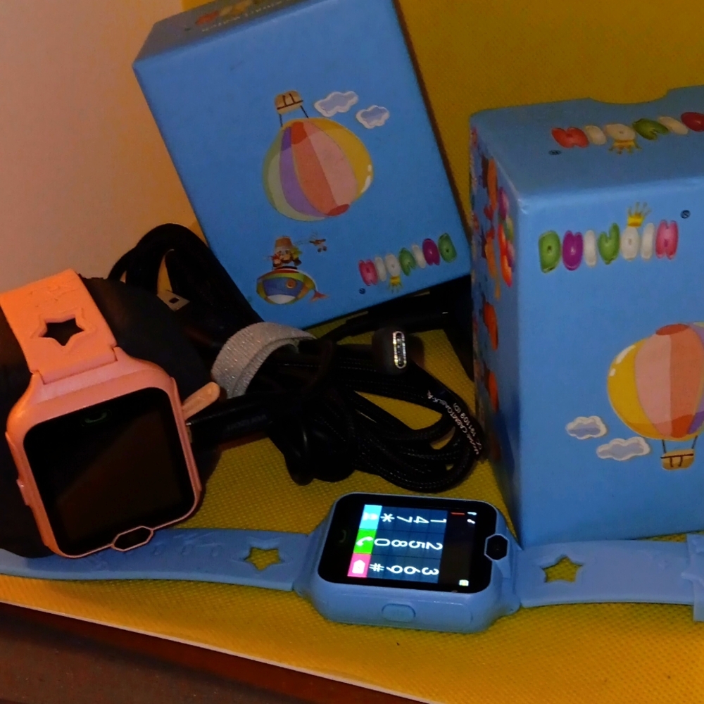 2- Kids Smart Watch,  Pink & Light Blue, Great Condition, zero use. W/Headphones